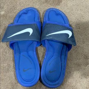 Blue Nike slides